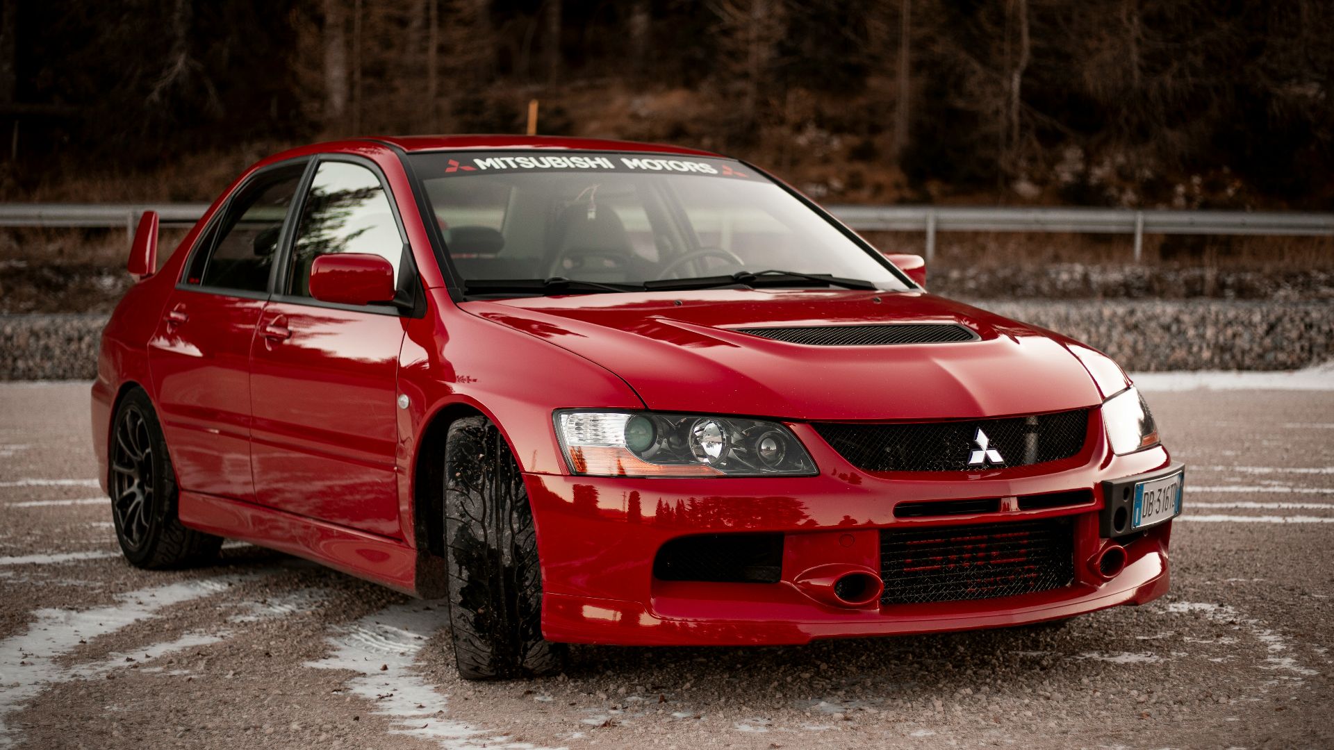 red chevrolet camaro on road during daytime