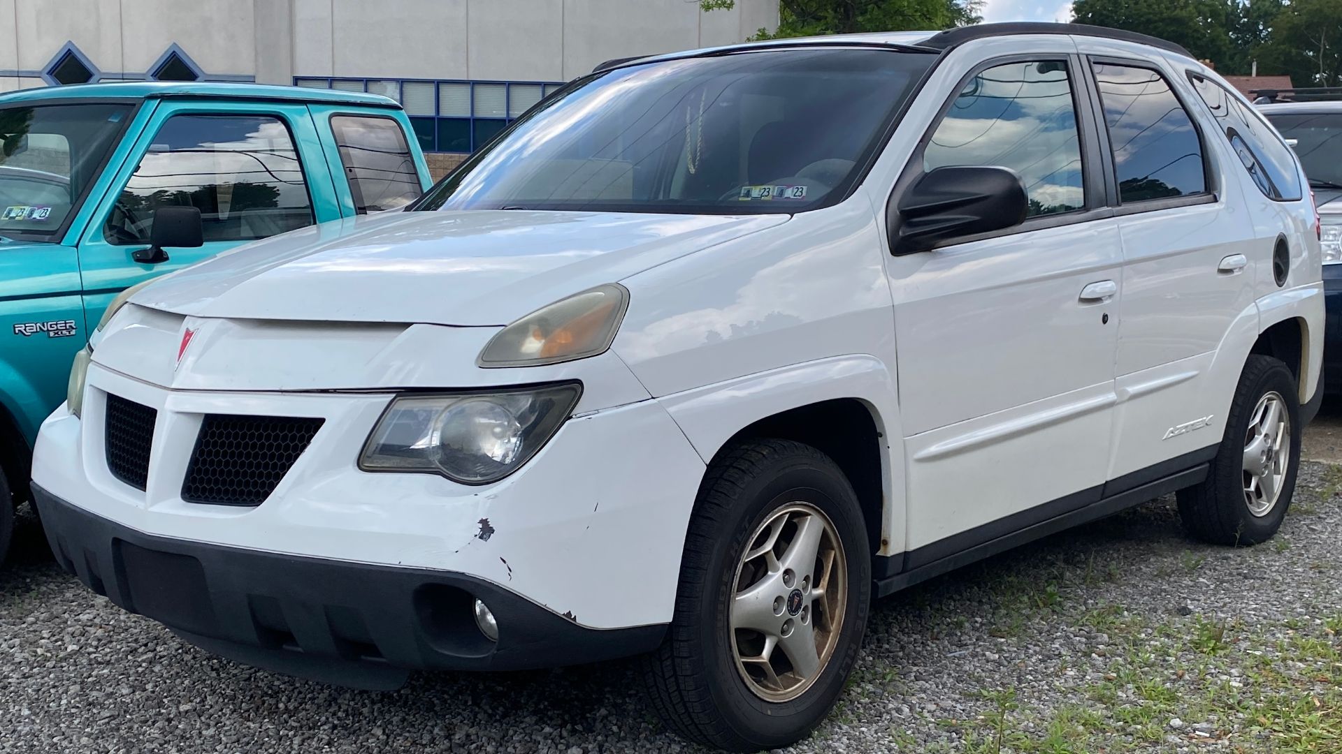 2004 Pontiac Aztek FWD photographed in Mt. Lebanon, Pennsylvania. This Aztek is equipped with the 3.4L V6 engine, and assembled in Ramoz Arizpe, Mexico. This year Aztek also happened to be the one famously featured in Breaking Bad, though the Aztek was Nature Green. A strange vehicle, but I like it.