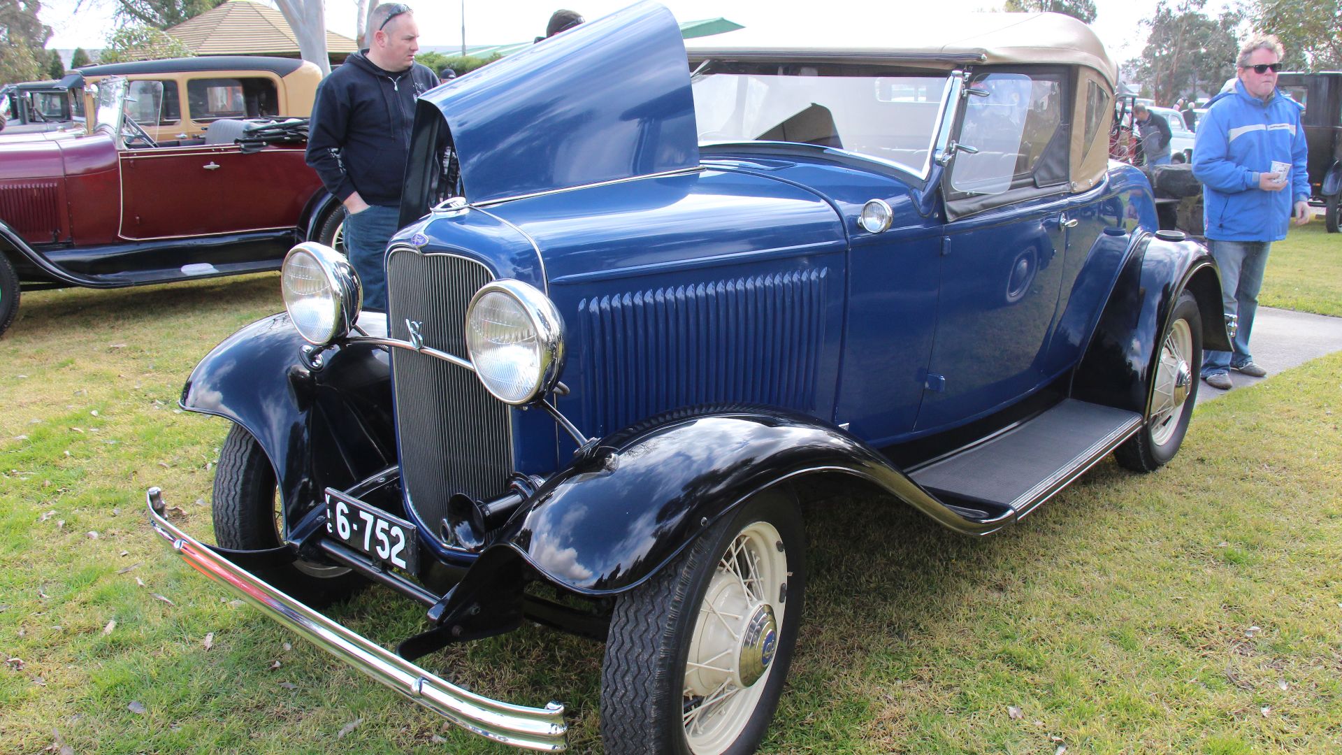 The 1932 Ford was available as the 201 cu in 4 cylinder Model B or the 221 cu in Flathead V8 Model 18, built on the same platform, they shared body, chassis and trim. Replacing the Model A, the new Ford not only got the new V8 option, but was on a longer wheelbase, got a lower hoodline and a new chassis, it was a much more comfortable car. The fuel tank was relocated from the cowl as in Model A, to the lower rear of the car, as is typical in modern cars. Again available in Standard or Deluxe and in a wide variety of body styles. 
The 32 Ford was not only built in the US but also in many countries including Australia.
The Model B carried on into 1933 and 34, the V8 tho was the Model 40 in 1933 and 40A in 1934 
These days, the Roadster and Coupe are the most popular for building street rods making original cars quite rare.

Engine; 50hp 201 cu in 4 cyl (Model B) or 65hp 221 cu in V8 (Model 18)
