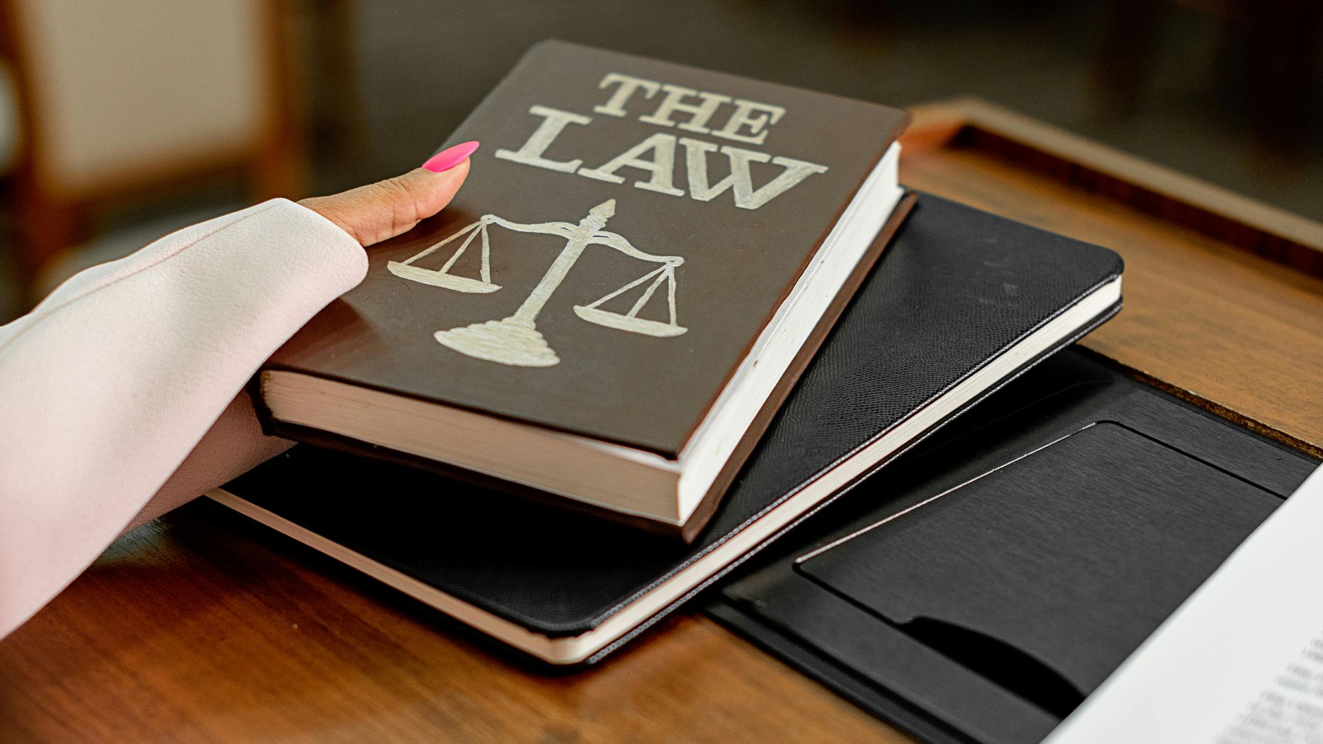 Close-up of a law book on a podium in a conference setting, symbolizing legal knowledge.