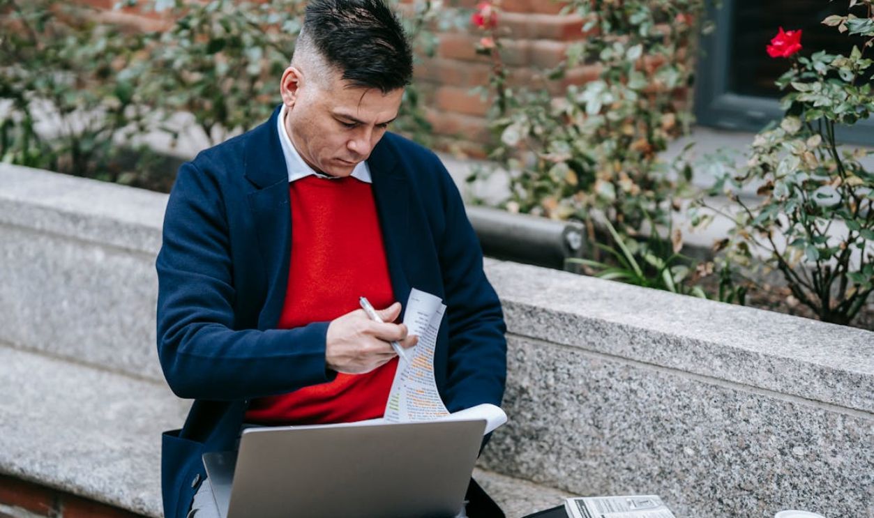 Photo Of Man Busy Looking On Papers