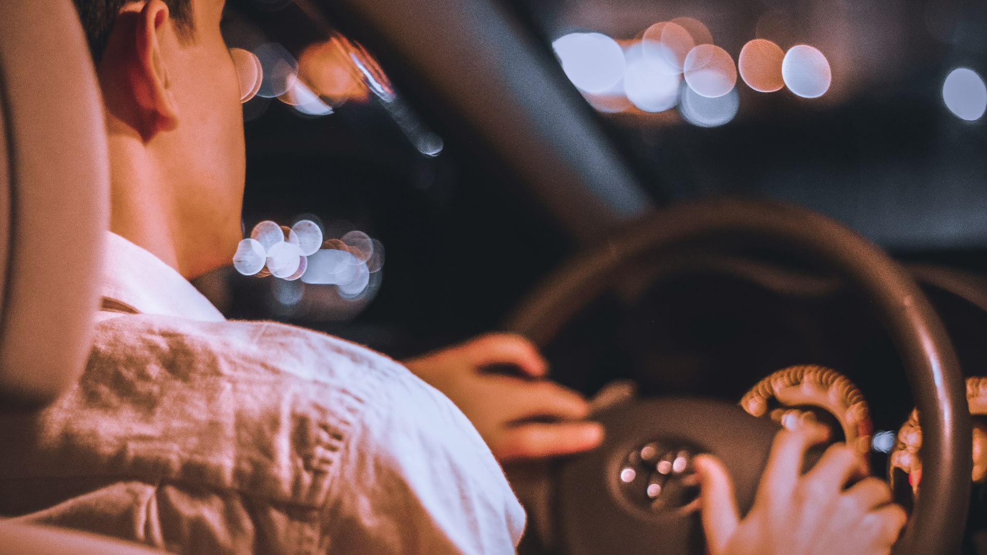 a man using a steering wheel