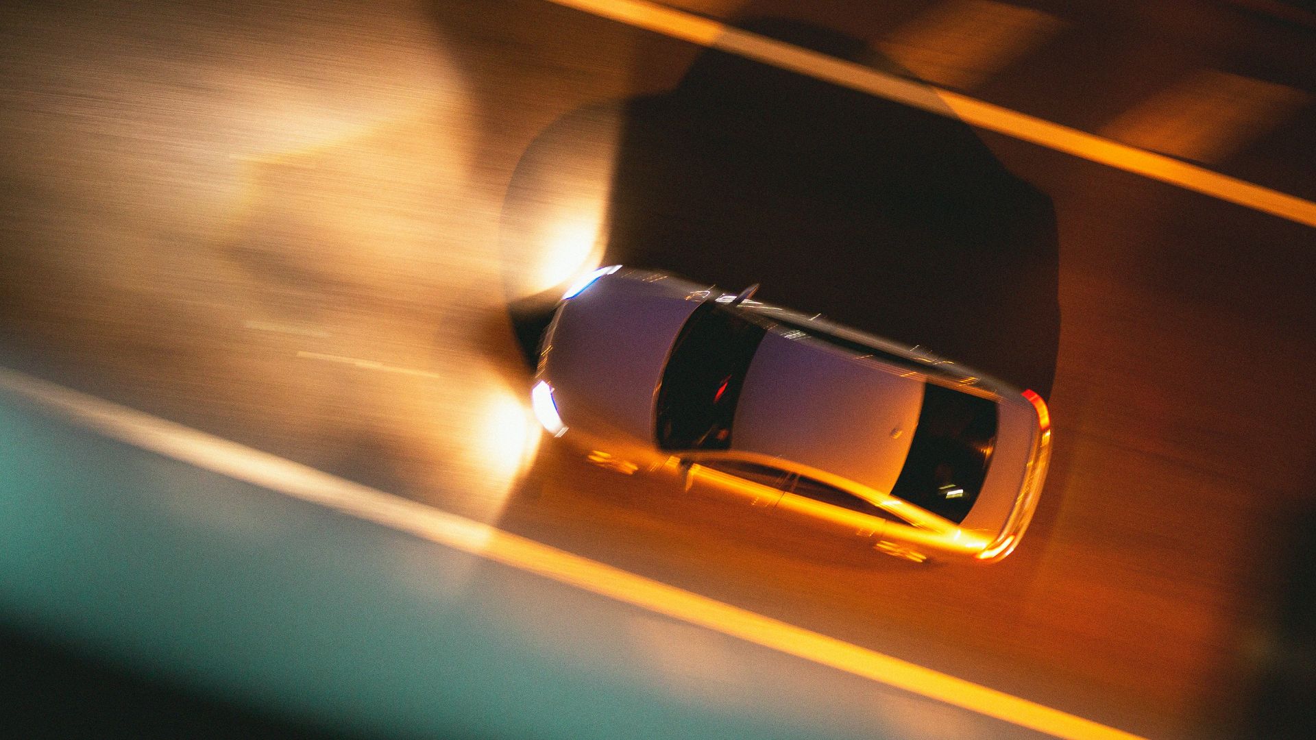 white car in motion during night time