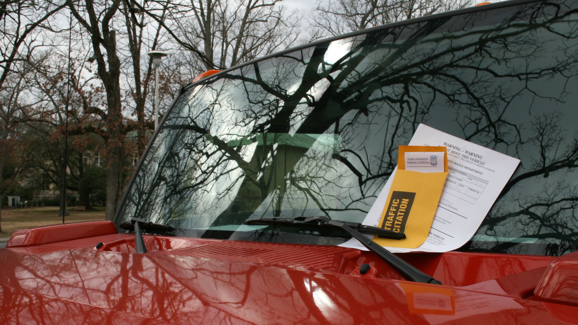A red Hummer with a parking ticket at Duke University East Campus in Durham, North Carolina.