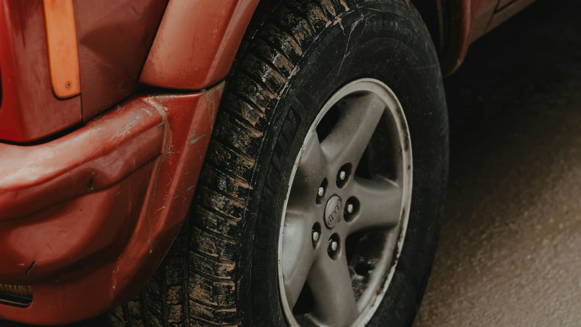 a red truck parked on the side of the road