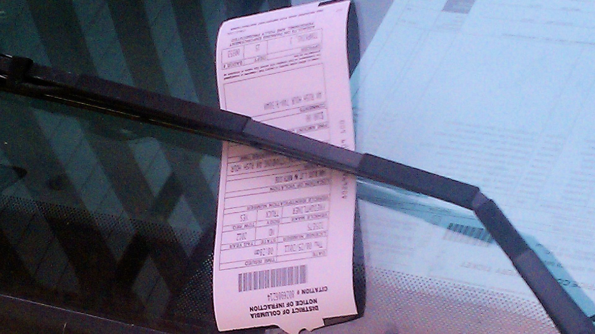 Parking ticket on the window of a commercial vehicle illegally parked in Washington, D.C., in the United States.