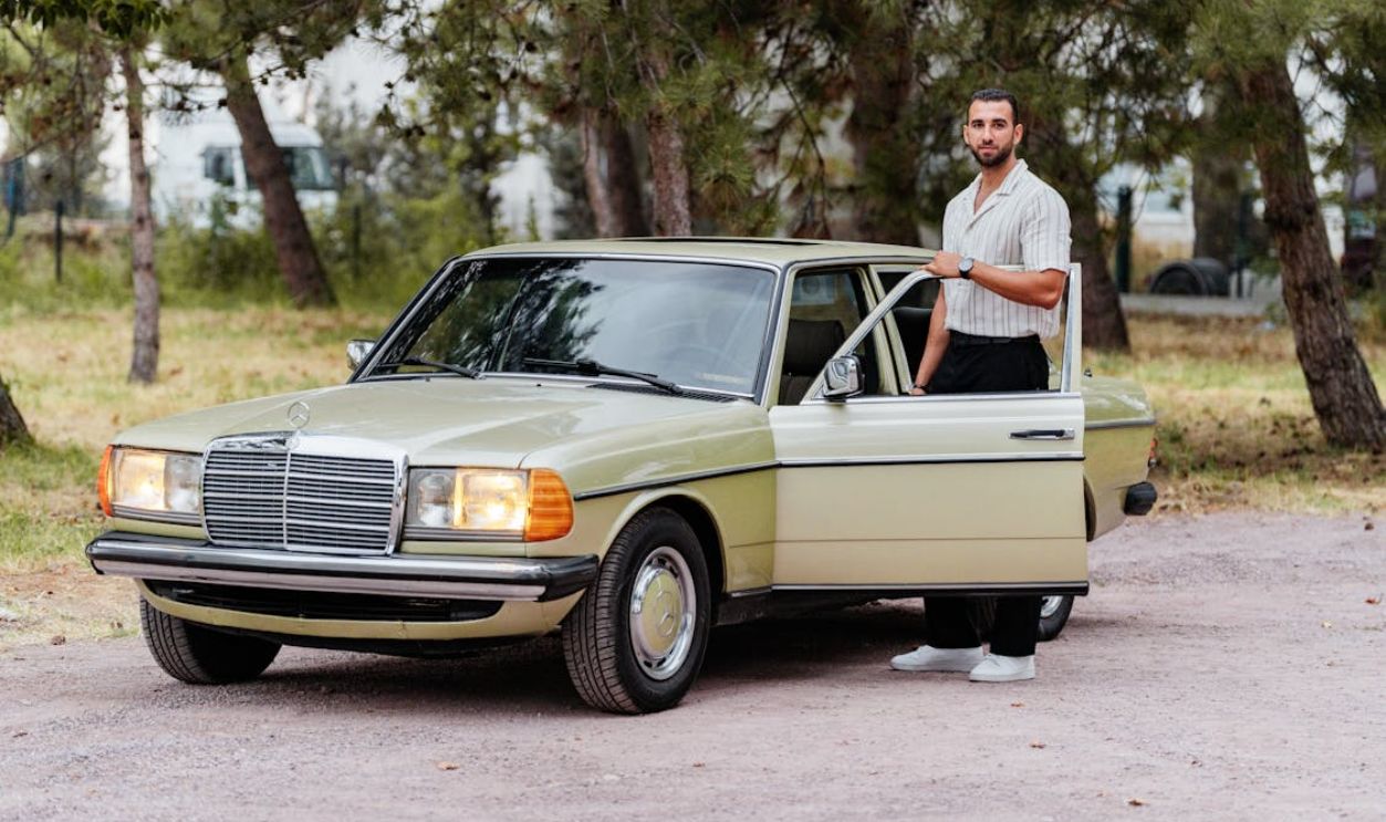 Classic Car with Driver in Scenic Outdoors