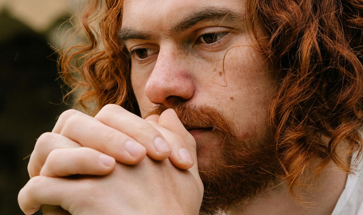 Bearded Man Praying with His Hands Clasped