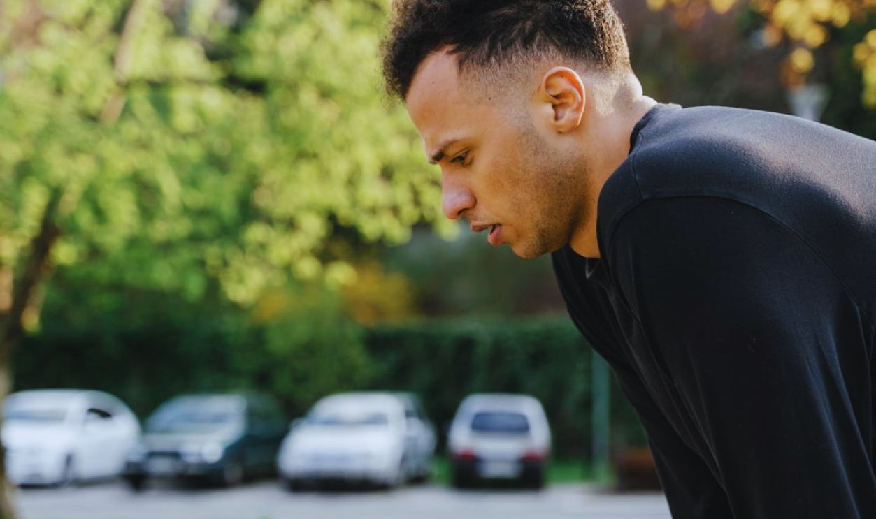 A Man in Black Clothing in Close-Up Photography