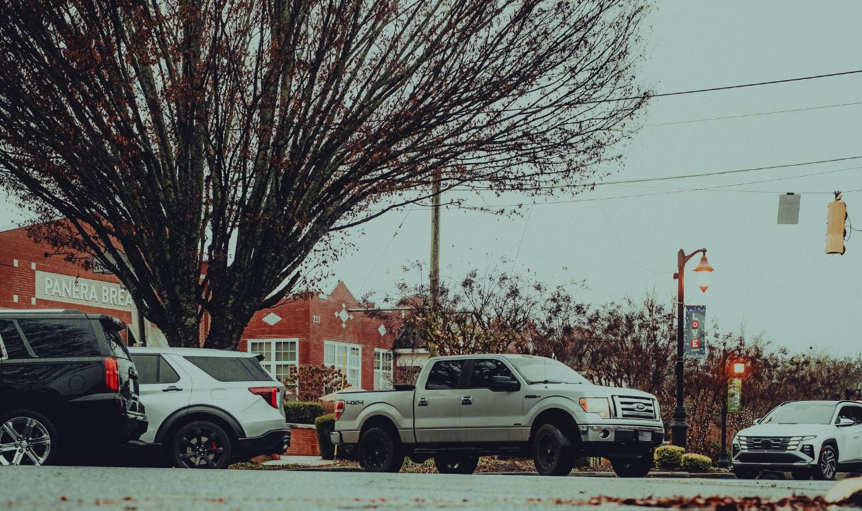 Urban Reflection on a Rainy Day Road