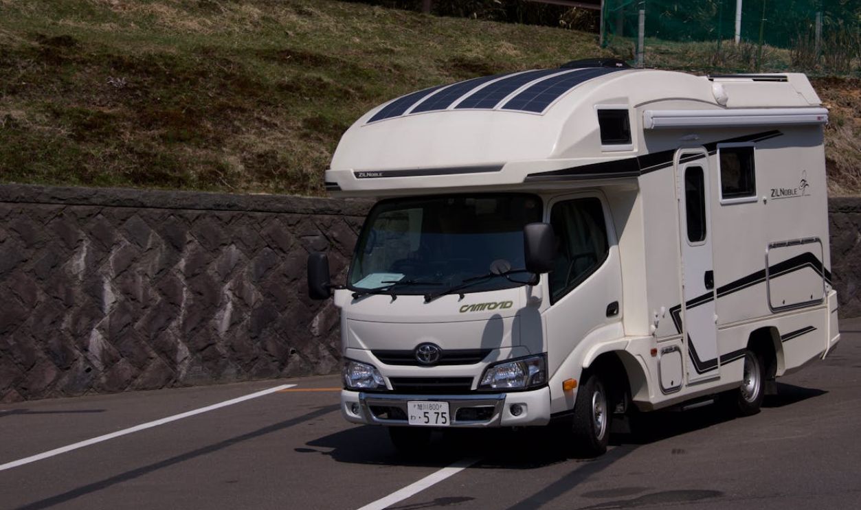Modern Camper Van Parked on a Sunny Roadside