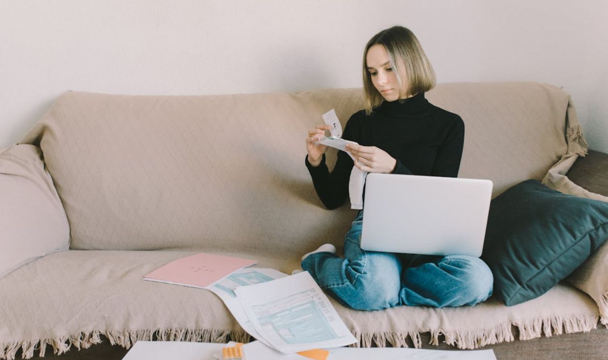 Woman in Black Long Sleeve Shirt Working at Home