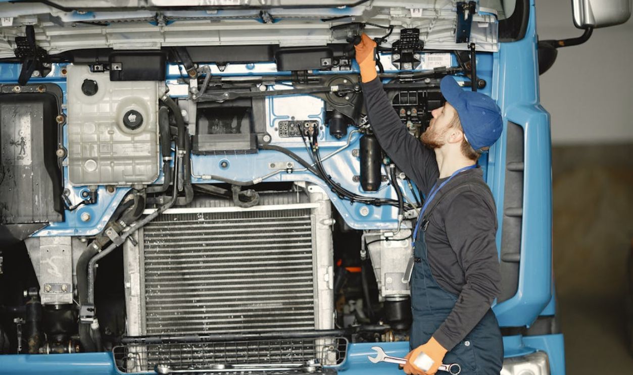 A Man Checking the Engine