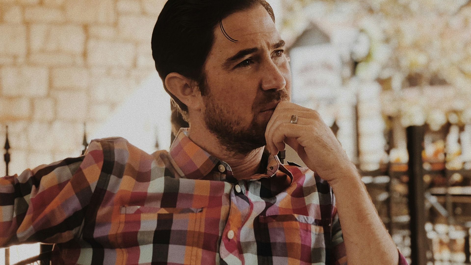 man in red and black plaid dress shirt