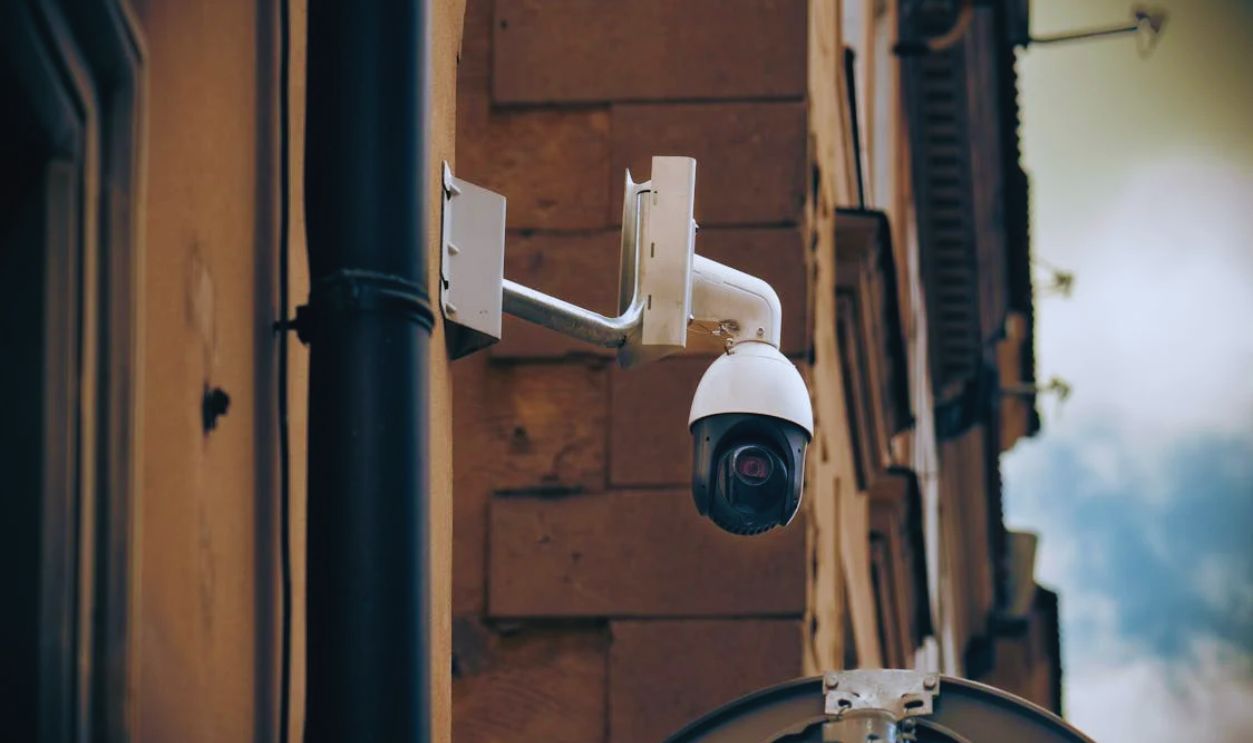 CCTV Camera on Wall in City