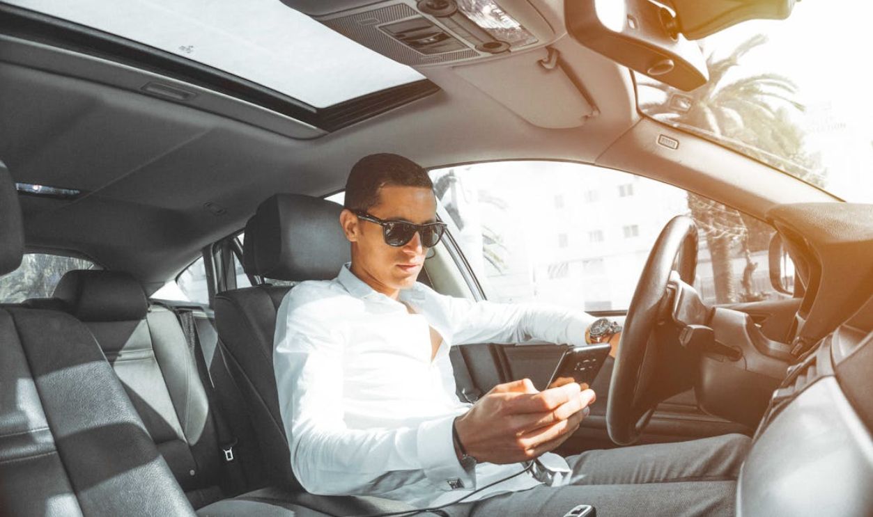 Man in White Dress Shirt Holding Smartphone