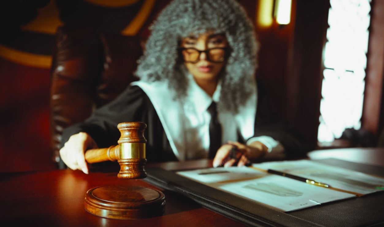 Judge in Courtroom with Gavel and Documents