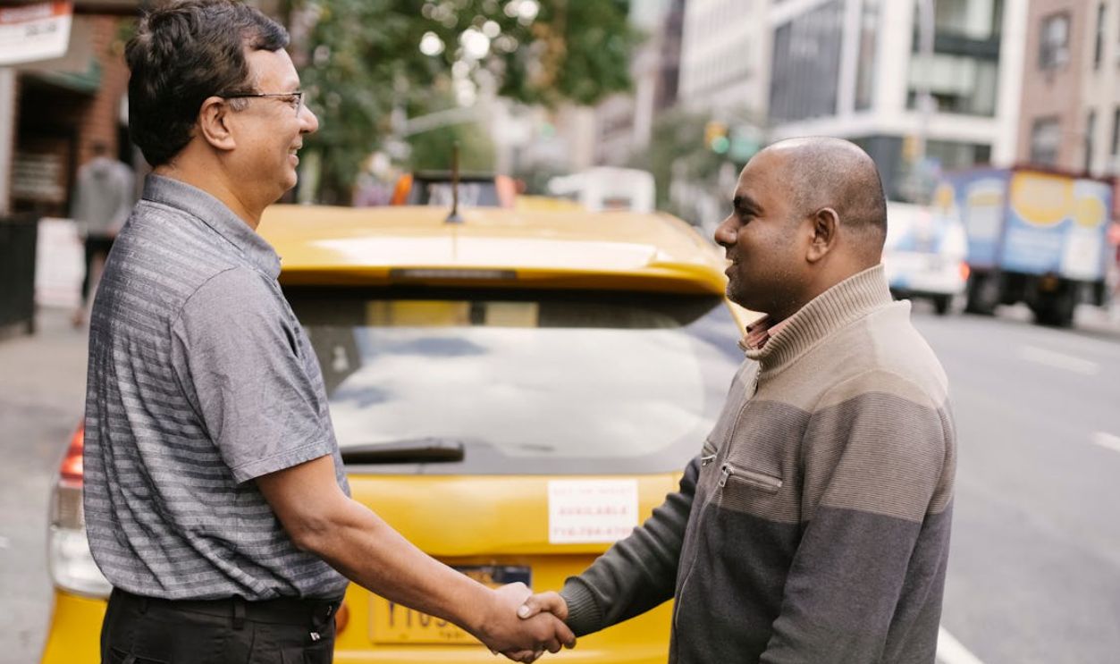 Men greeting each other on street