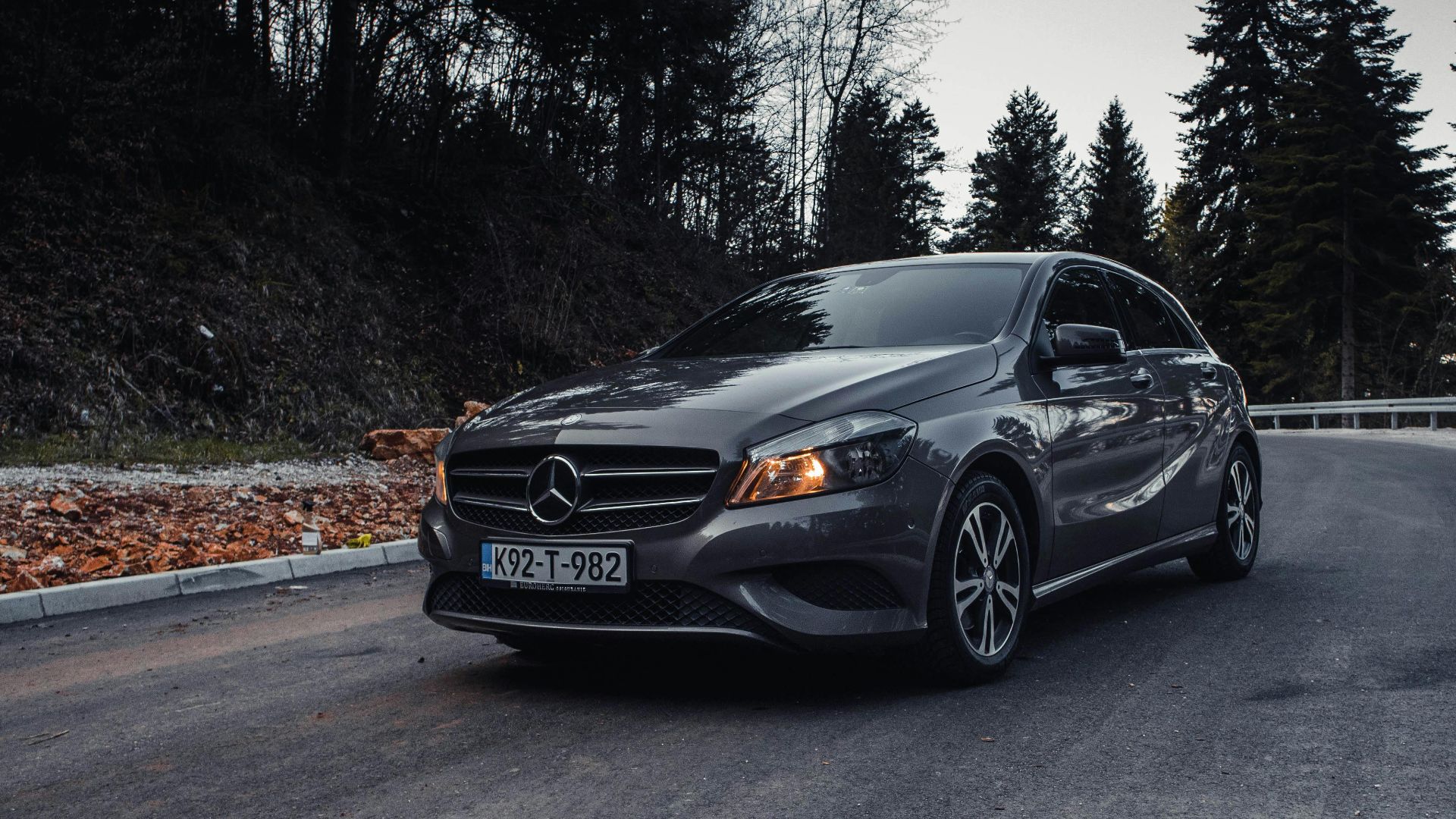 Cinematic shot of Mercedes-Benz on an asphalt road in Ilidža forest area.