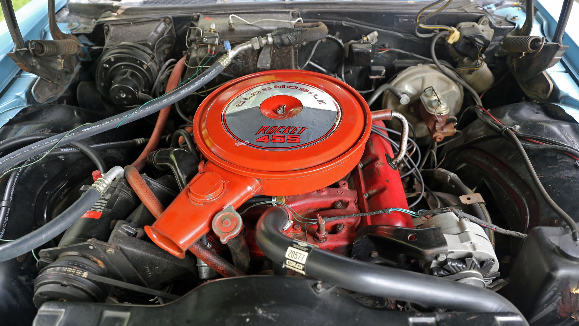 An Oldsmobile Rocket 455 engine in a 1968 Delmont 88 convertible. This was the first year for Oldsmobile's 455; they were only painted red in 1968 and 1969. The Delmont plate was retired after this year.