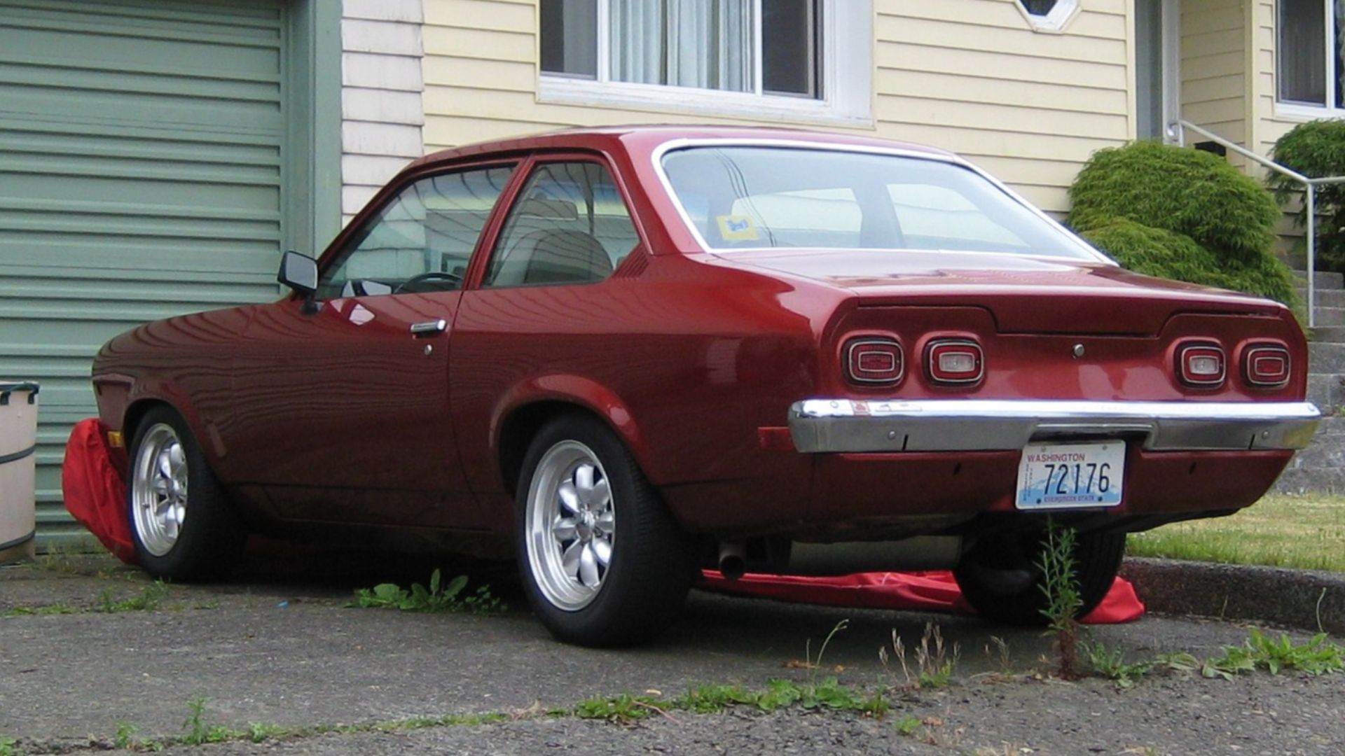 Has classic license plates, so is being cared for.  I've seen this car sitting here with a car cover most of the time, but when I walked by today it was out in the open.