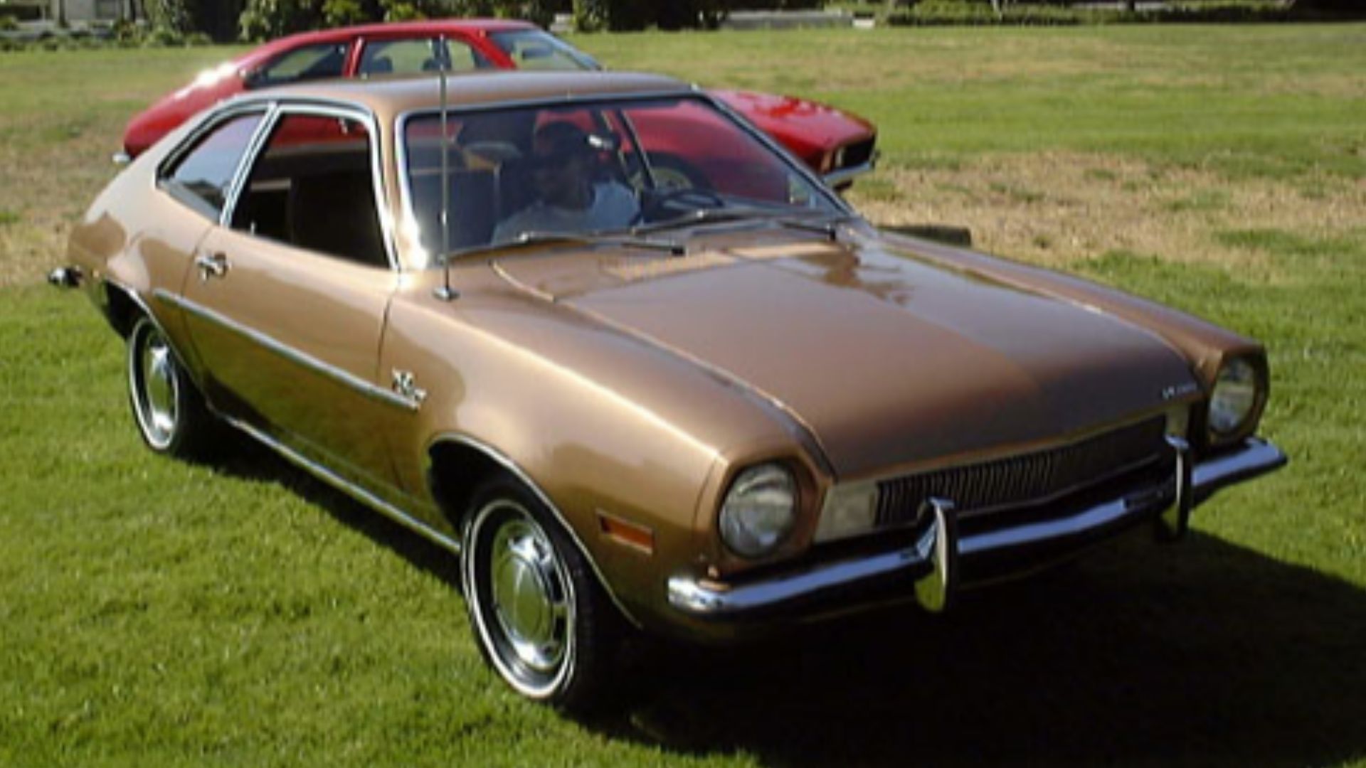 Ford Pinto.  Foreground car is a restored example; background is a hot-rodded version with popup headlights.