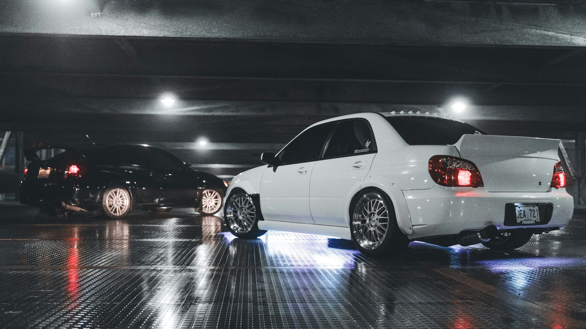 a white car parked in a parking garage