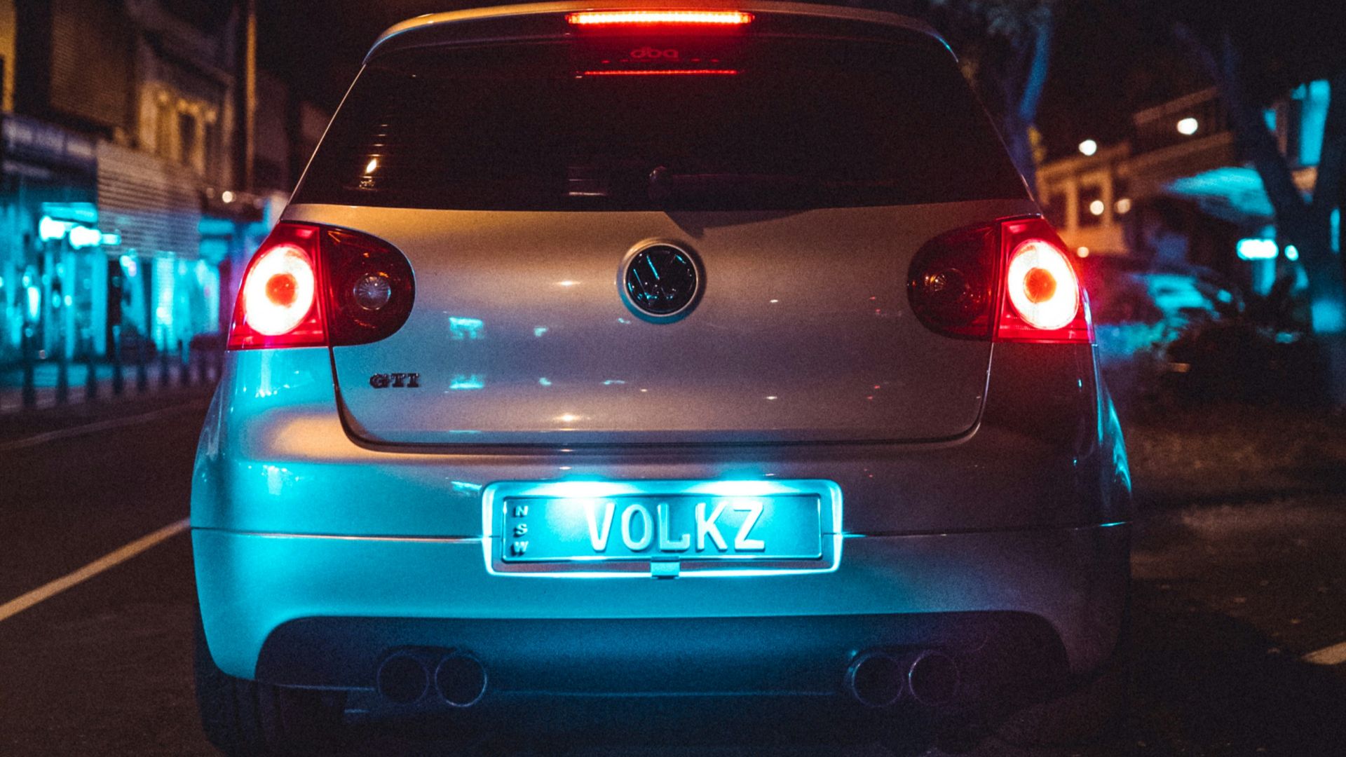 blue car on the road during night time