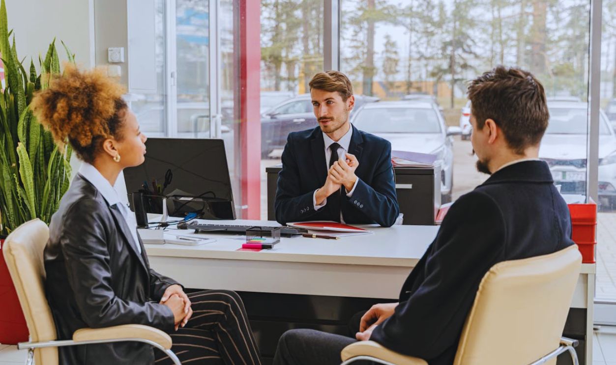 Professional meeting with clients at a modern office, discussing business solutions