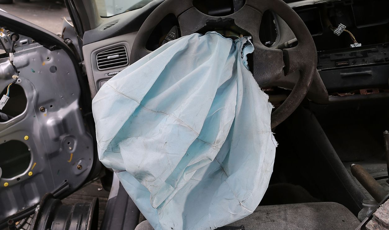 A deployed airbag is seen in a 2001 Honda Accord at the LKQ Pick Your Part salvage yard on May 22, 2015 in Medley, Florida. The largest automotive recall in history centers around the defective Takata Corp. air bags that are found in millions of vehicles that are manufactured by BMW, Chrysler, Daimler Trucks, Ford, General Motors, Honda, Mazda, Mitsubishi, Nissan, Subaru and Toyota.
