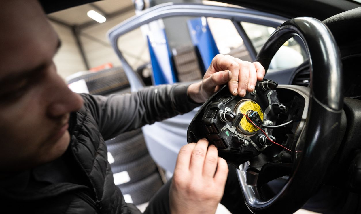 A mechanic removes from a car an airbag module made by the Japanese airbag manufacturer Takata, in a garage in Mulhouse, eastern France, on February 19, 2025. Some 236,900 Citroën C3 and DS 3 car owners in northern France were asked on February 18, 2025 not to drive their cars until their airbags had been replaced, as part of a new wave of immobilisations linked to the Takata scandal. 