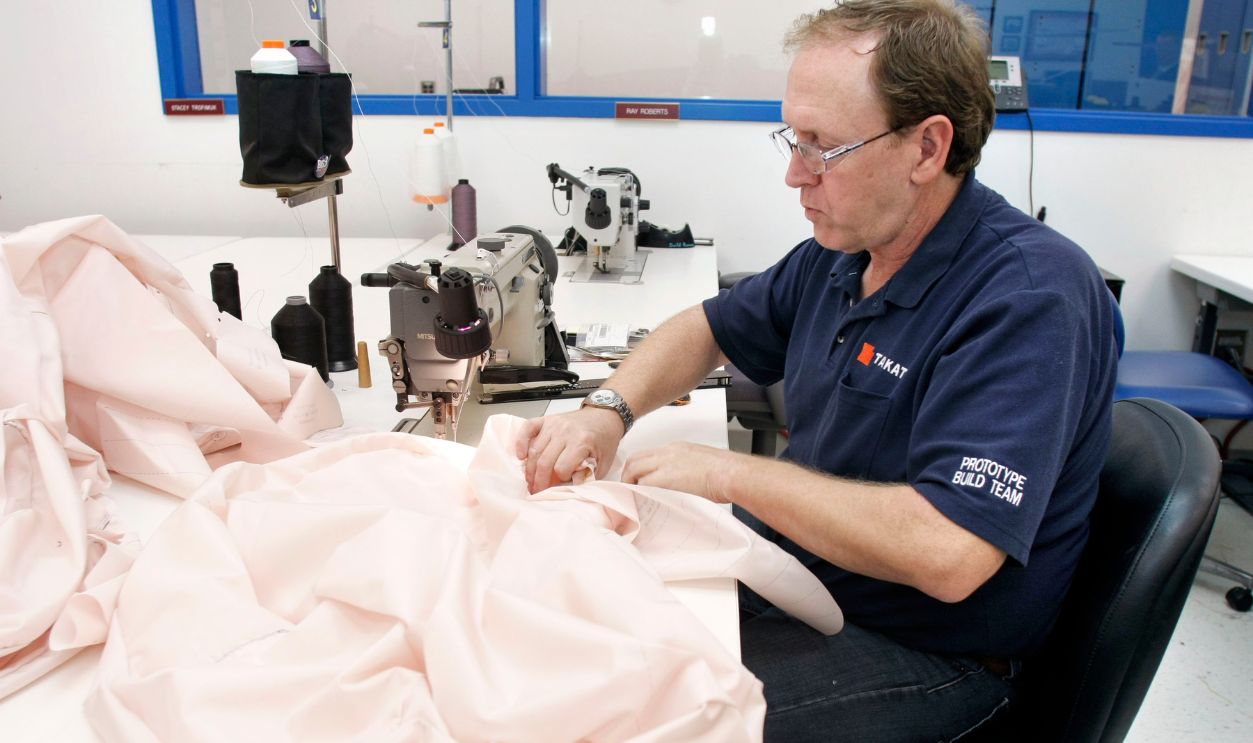 A Takata employee sews an airbag at Takata's current crash-testing facility August 19, 2010 in Auburn Hills, Michigan. Takata dedicated a new, high-tech 18,000 square-foot sled crash simulation facility today that cost $14.6 million and is expected to be built and operational by August of 2011.