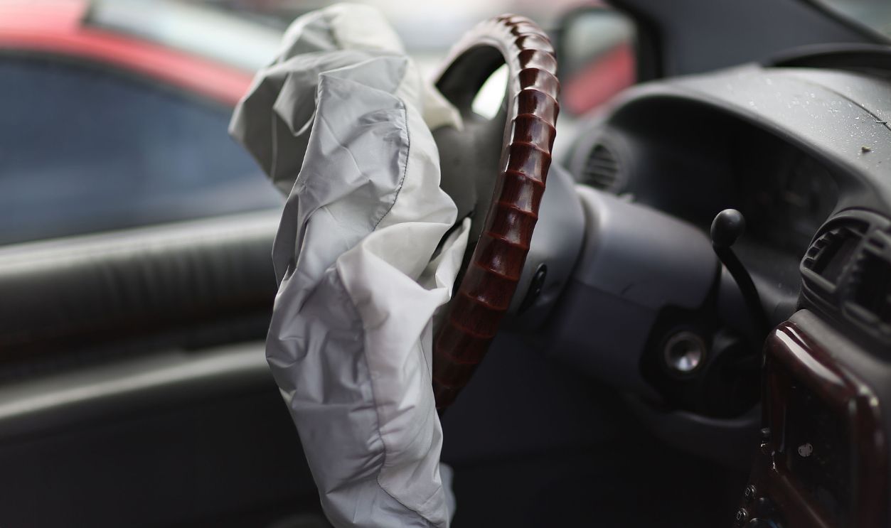 A deployed airbag is seen in a Chrysler vehicle at the LKQ Pick Your Part salvage yard on May 22, 2015 in Medley, Florida. The largest automotive recall in history centers around the defective Takata Corp. air bags that are found in millions of vehicles that are manufactured by BMW, Chrysler, Daimler Trucks, Ford, General Motors, Honda, Mazda, Mitsubishi, Nissan, Subaru and Toyota.