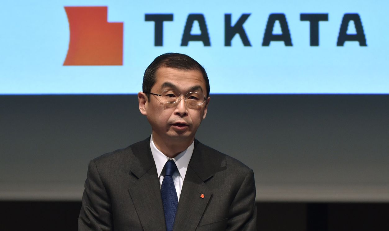 Japanese parts supplier Takata Corp President Shigehisa Takada holds a press conference in Tokyo on November 4, 2015. US auto safety regulators announced a record 200 million USD civil fine against Takata on November 4 for providing inadequate and inaccurate information about its dangerously explosive airbags installed in millions of cars. 