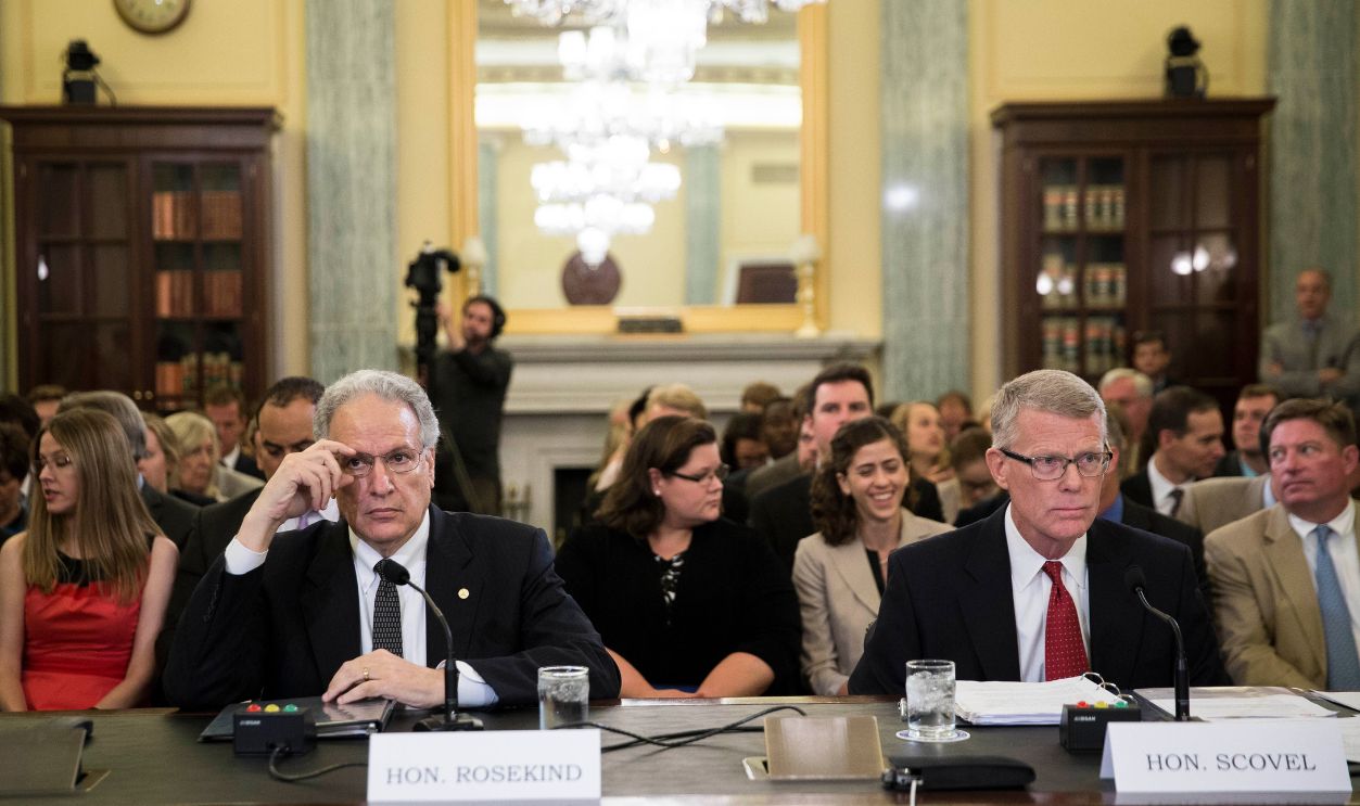 (L-R) Mark Rosekind, administrator at the National Highway Traffic Safety Administration, and Calvin Scovel III, inspector general at U.S. Department of Transportation, take their seats at the start of a Senate Commerce, Science, and Transportation Committee hearing entitled 