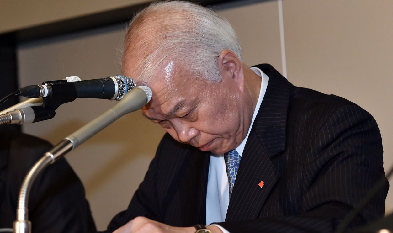 Japan's auto parts maker Takata executive Yoichiro Nomura bows his head as he announces the company's financial result ended March at the Tokyo Stock Exchange on May 8, 2015. Takata, at the centre of an exploding an exploding air-bag crisis, warned it has sunk into the red as the costs of huge global recalls pile up. Takata's faulty air bags have been linked to at least five deaths, posted a net loss of 29.56 billion yen (246 million USD) in the past year to March. 
