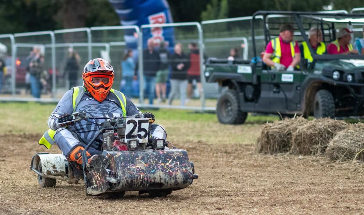 A racing lawn mower driver in the BLMRA 500, a Le Mans style 500 mile overnight lawn mower race in a field in West Sussex, UK. The British Lawn Mower Racing Association is holding its 50th anniversary 12 hour race overnight Saturday/Sunday with 52 teams, each with three drivers.