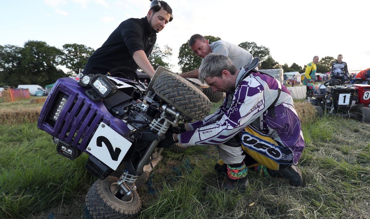A team check their lawn mower before the beginning of the British Lawn Mower Racing Association 12 hour endurance race at Five Oaks near to Billingshurst in West Sussex.