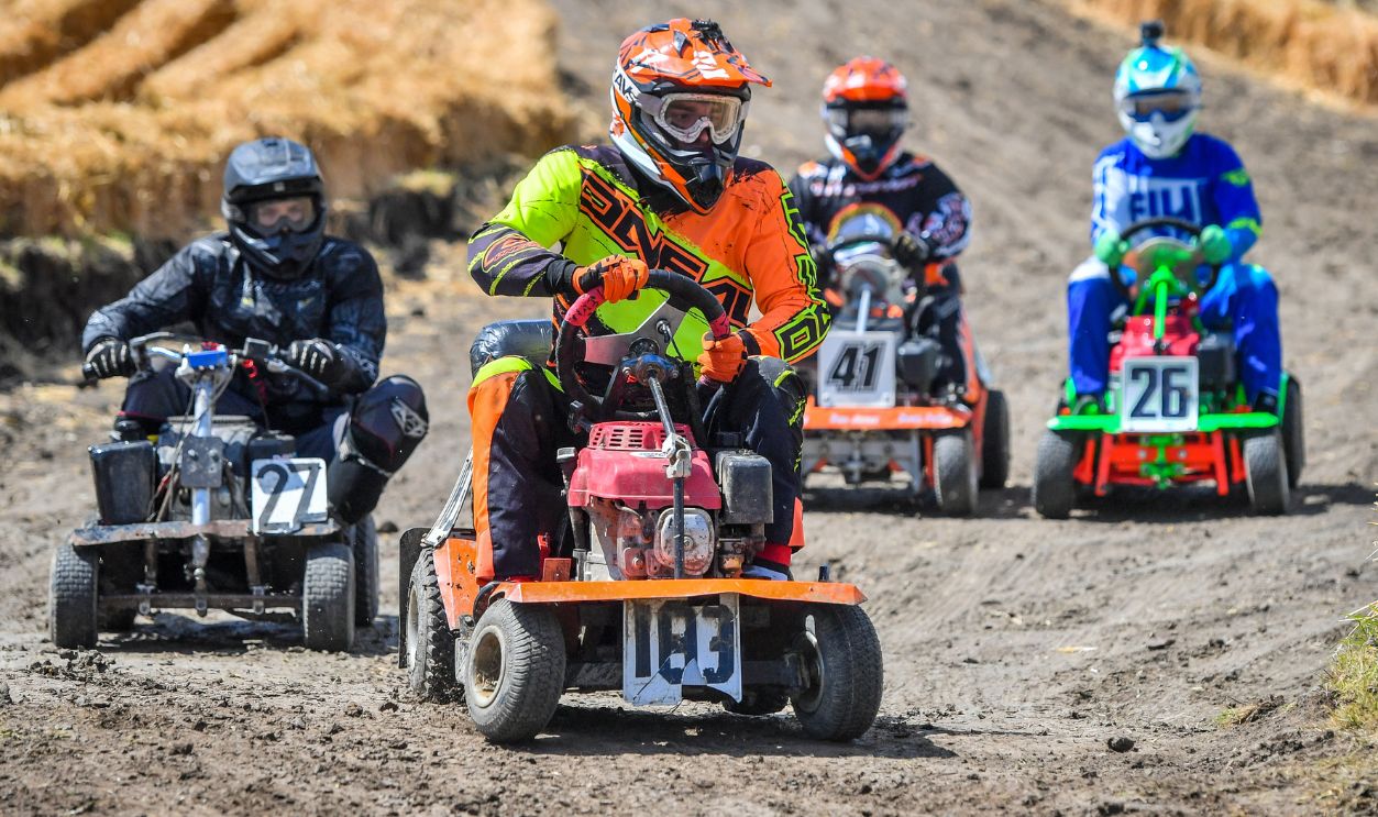 Competitors battle it out during the Red Bull Cut It, lawn mower racing event, where participants reach speeds of up to 50mph on modified ride-on lawnmowers as they navigate their way around four separate courses at Chestnut House, in Lower Weare, Axbridge. 