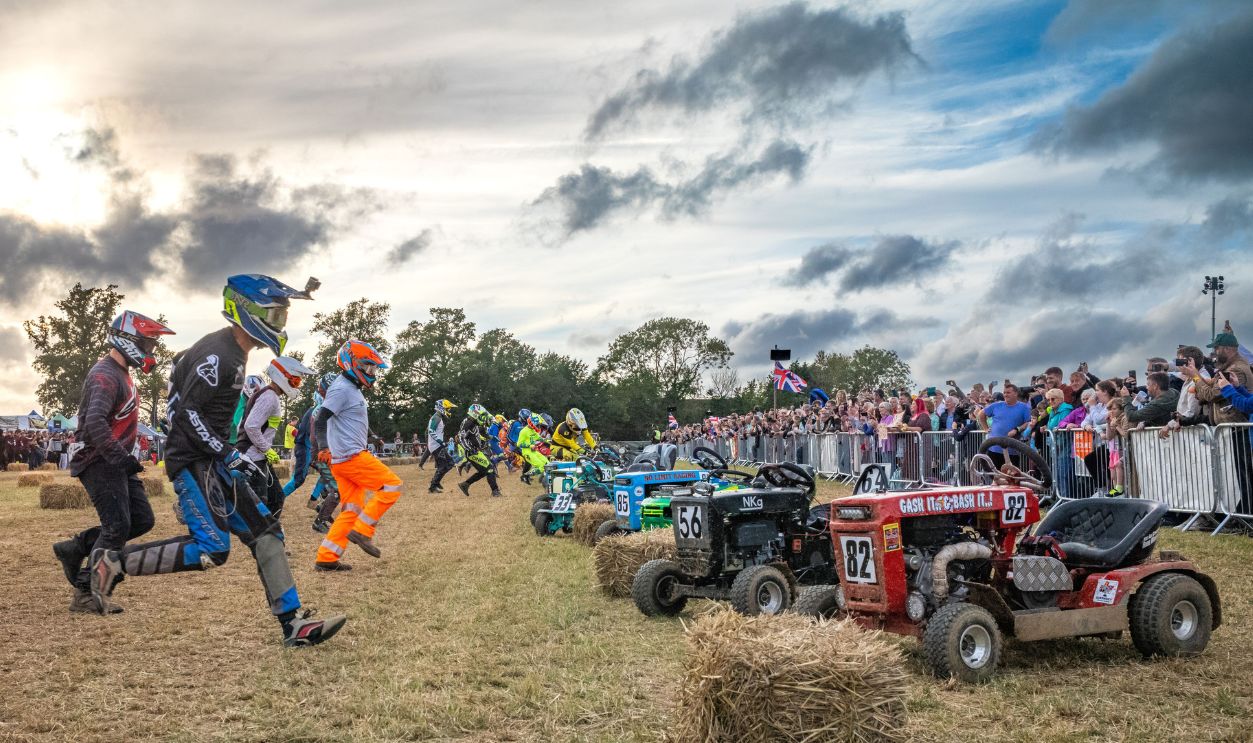 Drivers sprint to their racing lawn mowers at dusk at the start of the BLMRA 500, a Le Mans style 500 mile overnight lawn mower race in a field in West Sussex, UK. The British Lawn Mower Racing Association is holding its 50th anniversary 12 hour race overnight Saturday/Sunday with 52 teams, each with three drivers. 