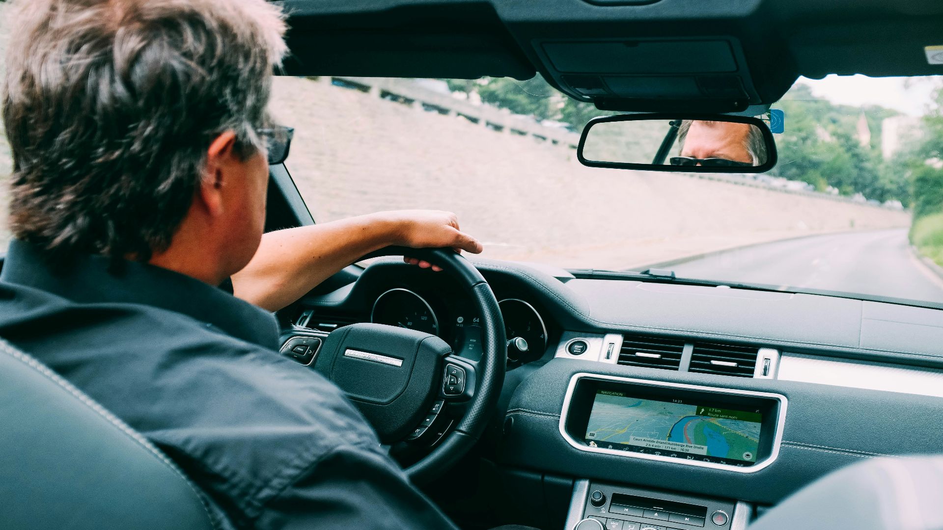 man driving vehicle during daytime