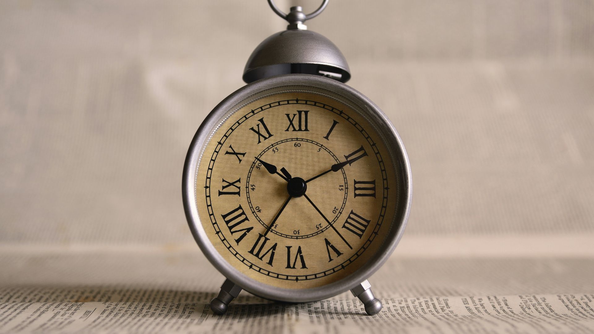 turned on gray alarm clock displaying 10:11