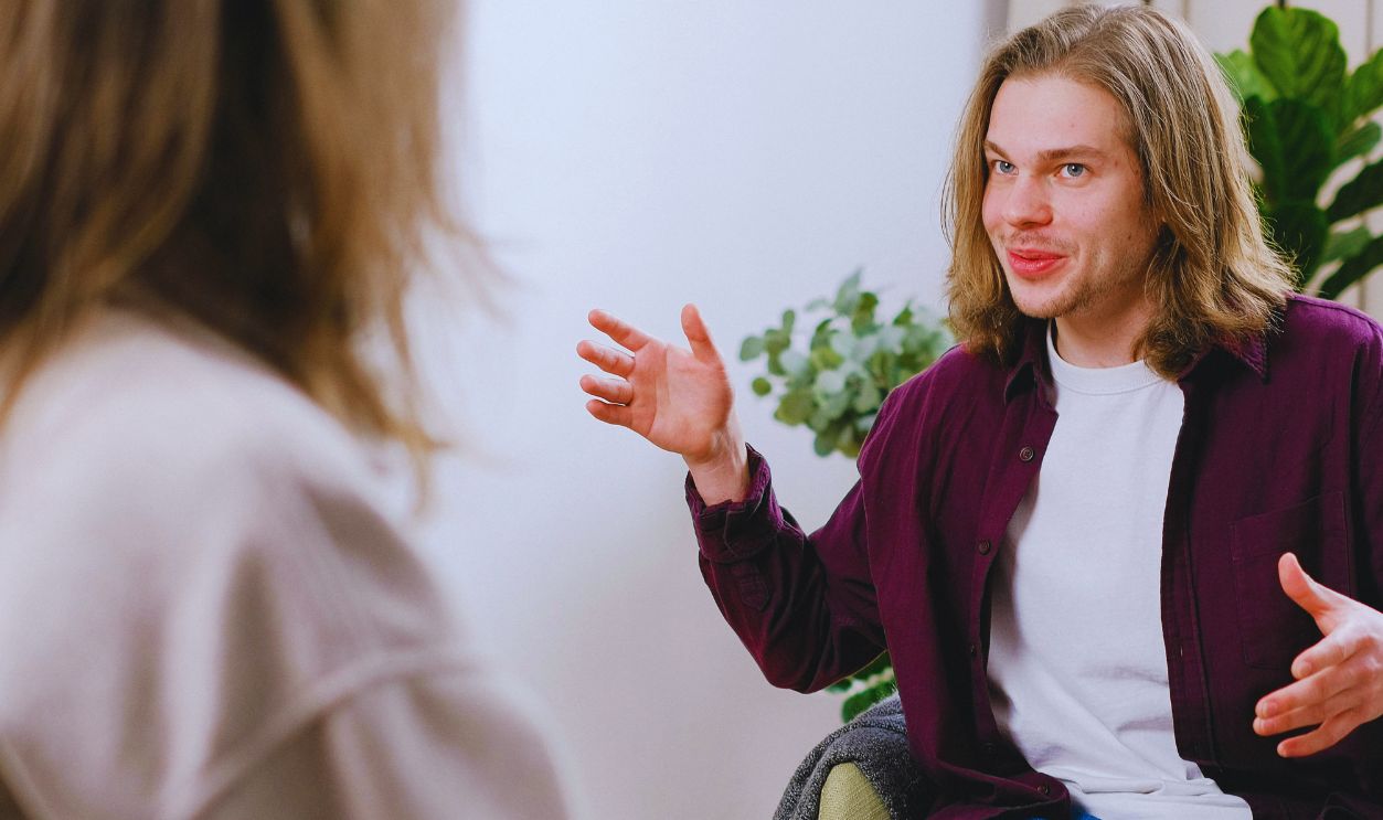 A therapist and patient in a conversational therapy session indoors