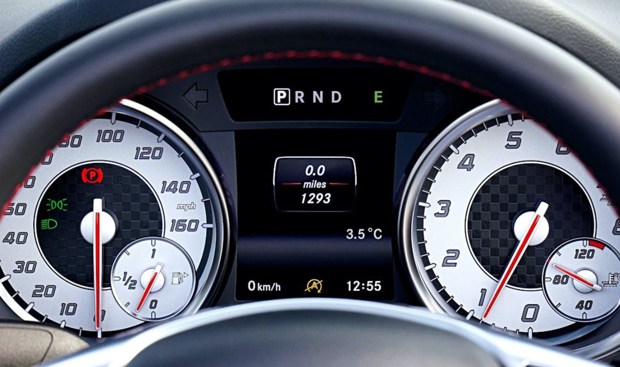Detailed view of a car's dashboard showing speedometer, odometer, and controls
