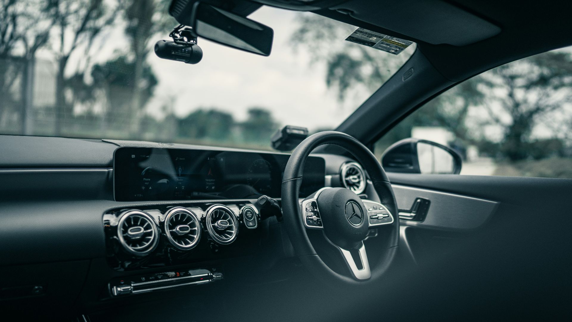 black and silver steering wheel