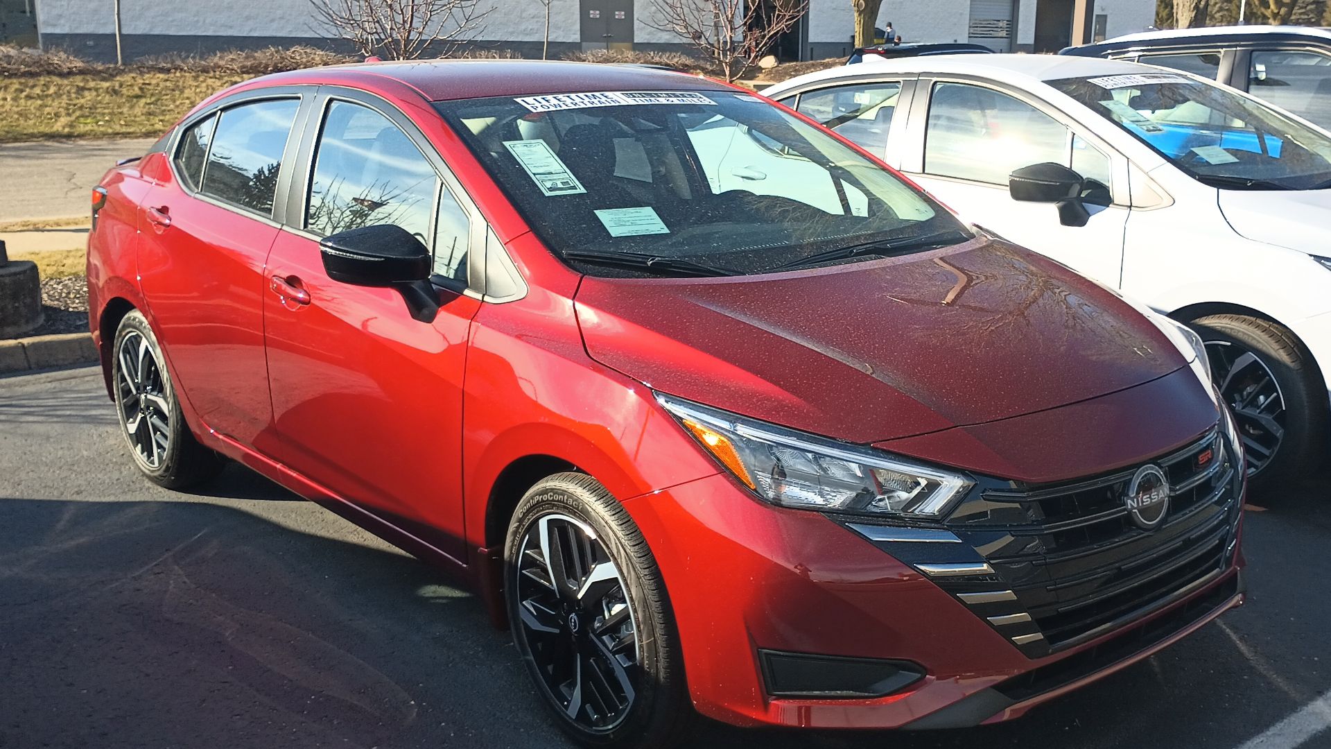 Front view of a 2024 Nissan Versa SR subcompact car.