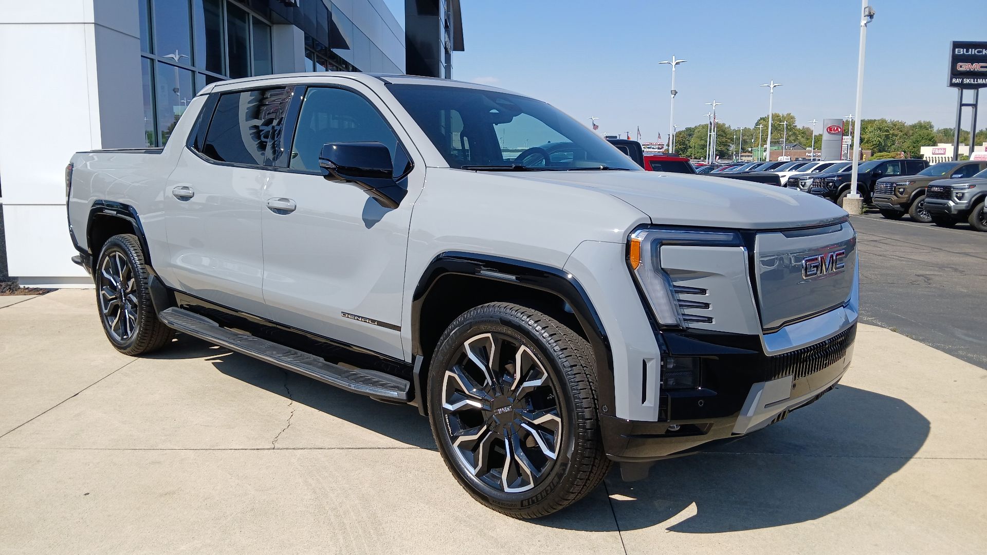 Front view of a 2024 GMC Sierra EV Denali crew cab full-size electric pickup truck.