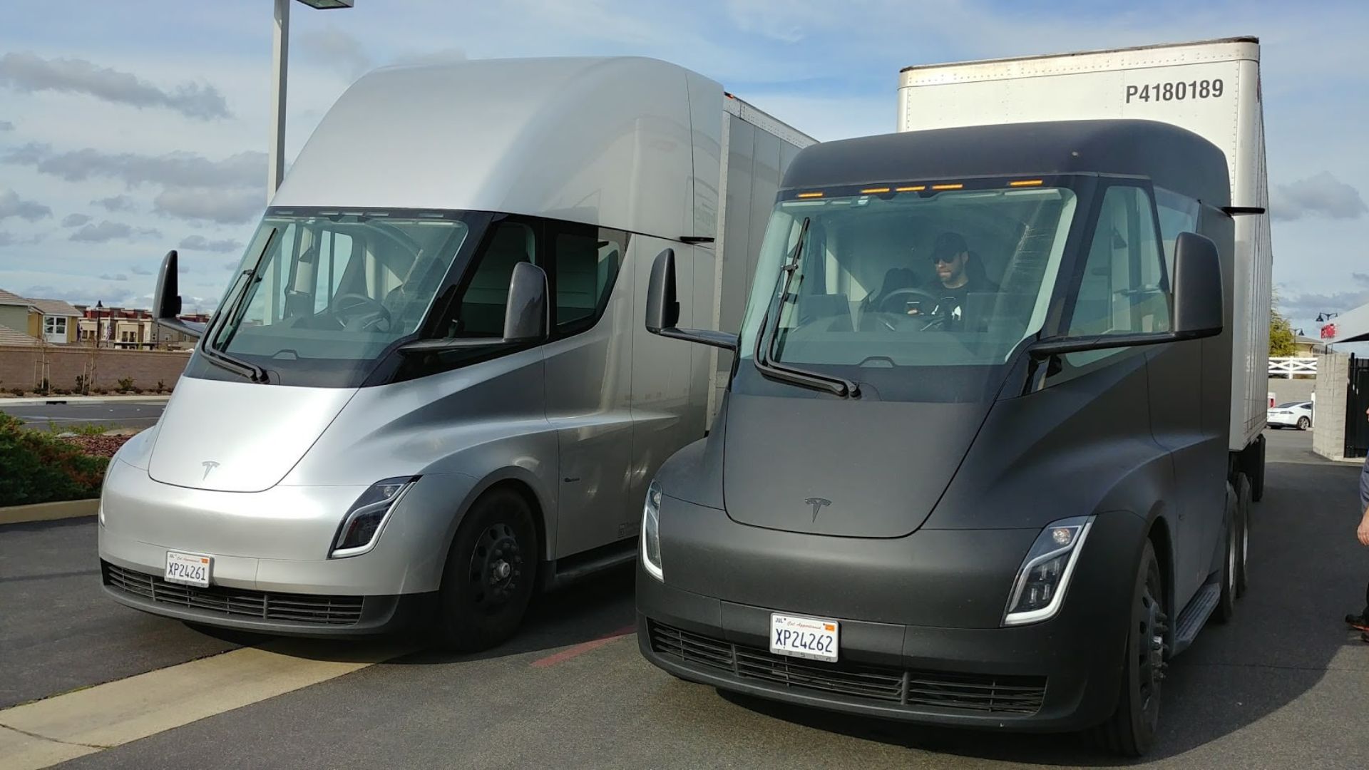 A silver and a black Tesla Semi in Rocklin, California
