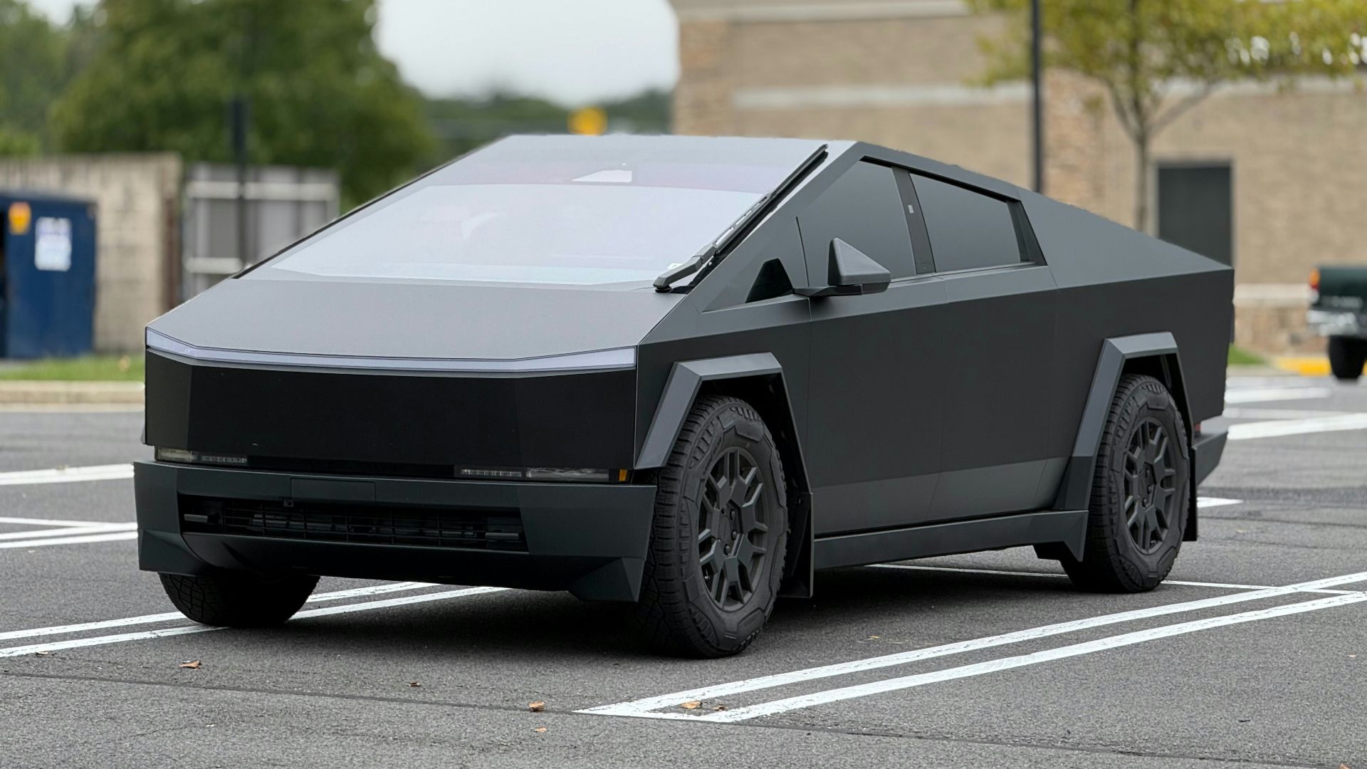 A futuristic car is parked in a parking lot