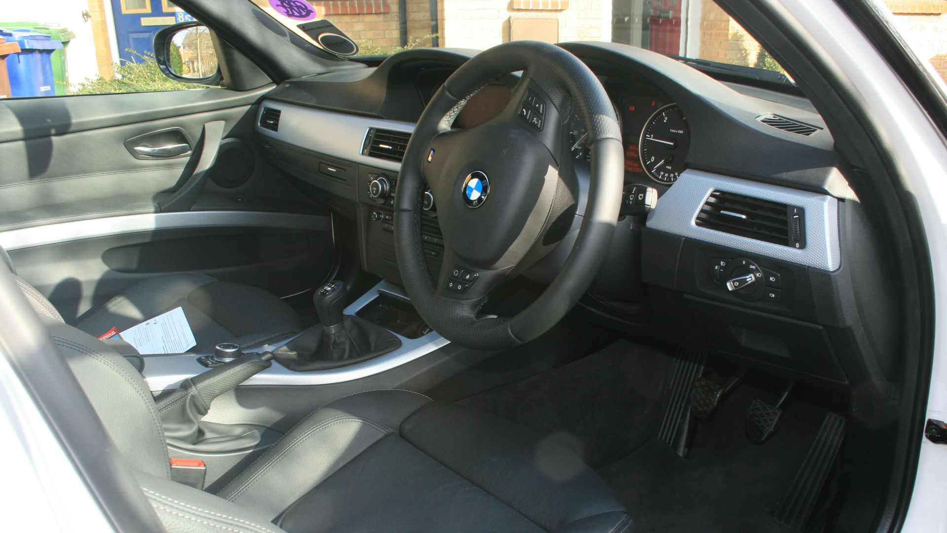 inside my new BMW, includes I-Drive, heated leather seats, sunroof etc